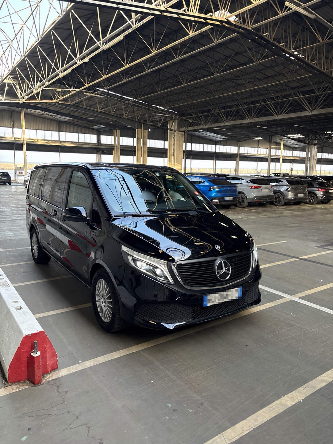 Black Mercedes-Benz EQV with registration plate obscured